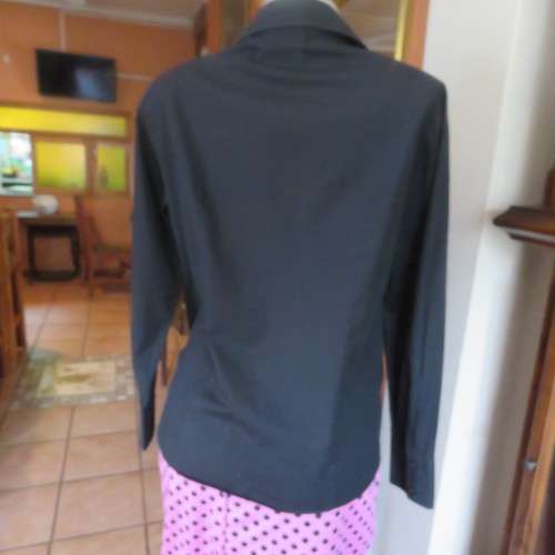 Timeless black long sleeve shirt by 'Woolworths' in size 38/14. Cuffed sleeves. In 100% cotton.