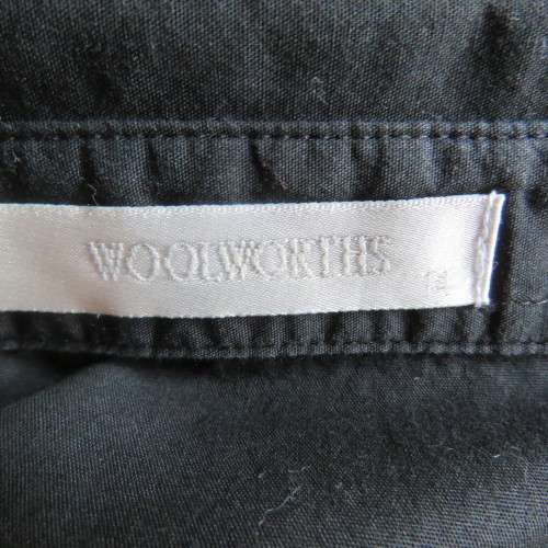 Timeless black long sleeve shirt by 'Woolworths' in size 38/14. Cuffed sleeves. In 100% cotton.