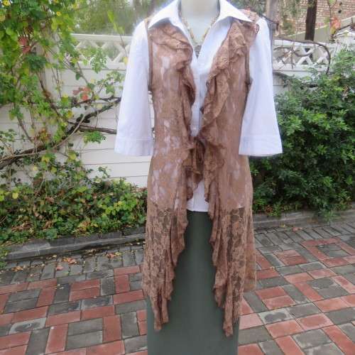 Stylish light brown acrylic stretch lace sleeveless gilet with wide frill all around. Size 34/10.