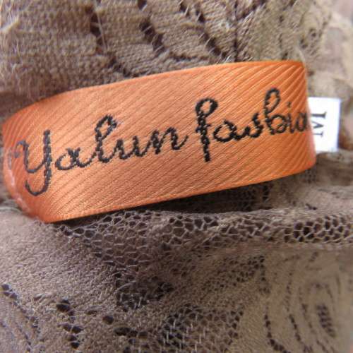 Stylish light brown acrylic stretch lace sleeveless gilet with wide frill all around. Size 34/10.