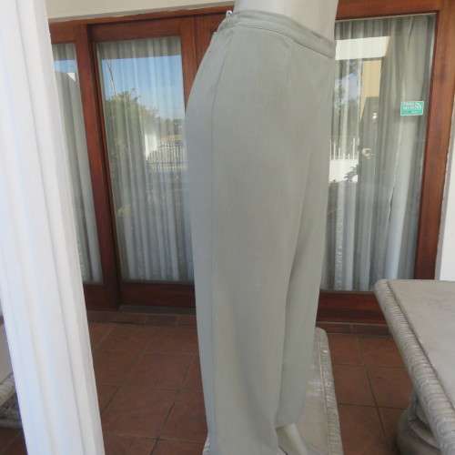 Comfy ankle length fern green pants in size 40/16 by `WOOLWORTHS`. In 100% wash + wear polyester.