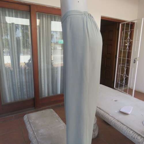 Comfy ankle length fern green pants in size 40/16 by `WOOLWORTHS`. In 100% wash + wear polyester.