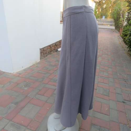 Elegant paneled A line skirt in ecru  with silver  thread embroidery on front. Size 42/18. As new