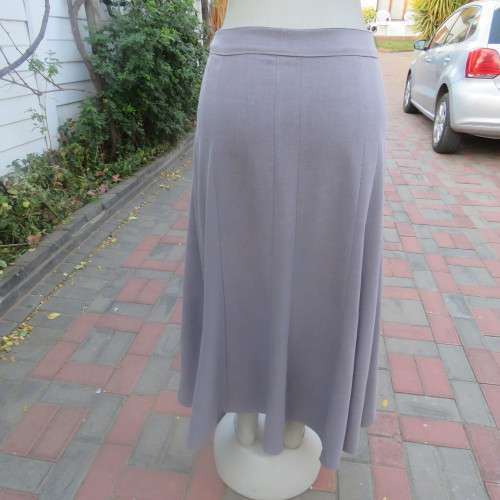Elegant paneled A line skirt in ecru  with silver  thread embroidery on front. Size 42/18. As new