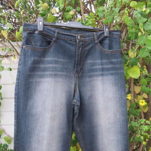Fashion blue denim jeans in size 42/18.In stretch polyester fabric. Straight legs. As new.
