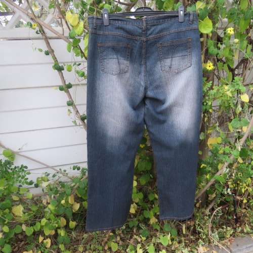 Fashion blue denim jeans in size 42/18.In stretch polyester fabric. Straight legs. As new.