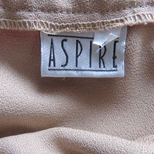 Rich cream colour pencil skirt in size 46/22 by ASPIRE. Black edging on front waistband. Good cond.