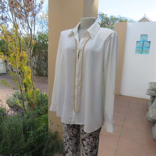 Sophisticated soft cream long sleeve top by 'WOOLWORTHS' in size 44/20. New condition. Used once.