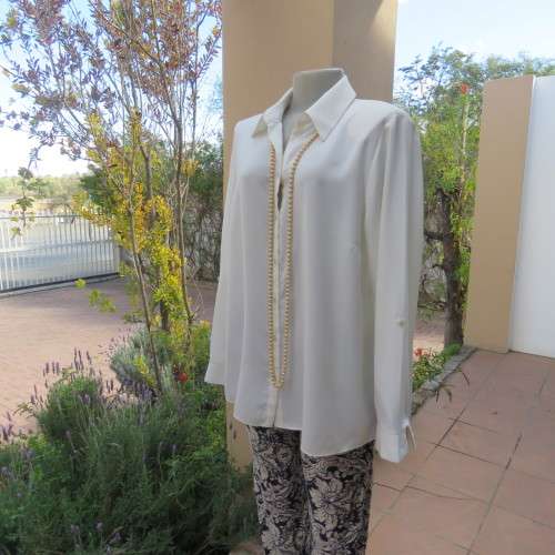 Sophisticated soft cream long sleeve top by 'WOOLWORTHS' in size 44/20. New condition. Used once.