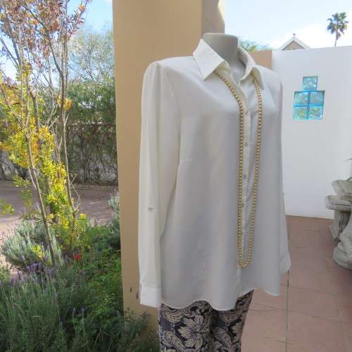 Sophisticated soft cream long sleeve top by 'WOOLWORTHS' in size 44/20. New condition. Used once.