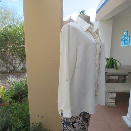 Sophisticated soft cream long sleeve top by 'WOOLWORTHS' in size 44/20. New condition. Used once.