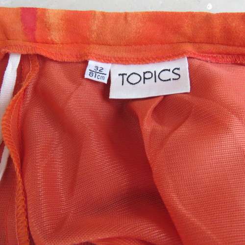 Eyecatching orange floral bodycon skirt in sheer viscose with lining. Size 32/8 by TOPICS.As new