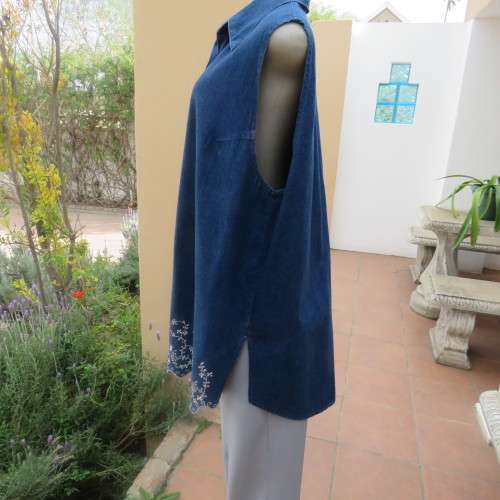Sassy blue denim button down top with shirt collar and dainty white seam embroidery. Size 46 to 48