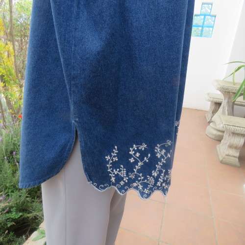 Sassy blue denim button down top with shirt collar and dainty white seam embroidery. Size 46 to 48