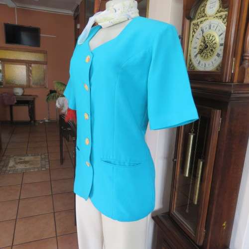 Elegant tailored turquoise fully lined short sleeve jacket. By KILDARE in size 36/12. As new.