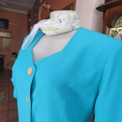 Elegant tailored turquoise fully lined short sleeve jacket. By KILDARE in size 36/12. As new.