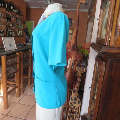 Elegant tailored turquoise fully lined short sleeve jacket. By KILDARE in size 36/12. As new.