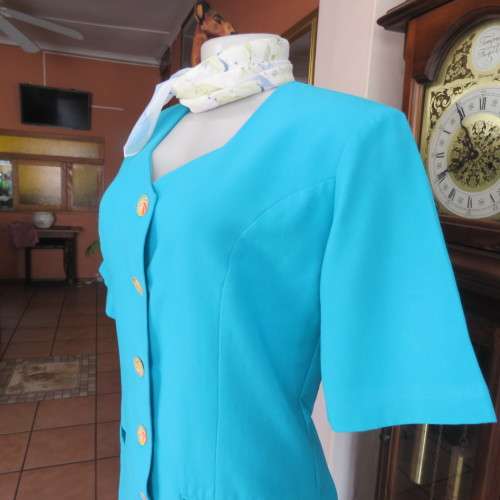 Elegant tailored turquoise fully lined short sleeve jacket. By KILDARE in size 36/12. As new.