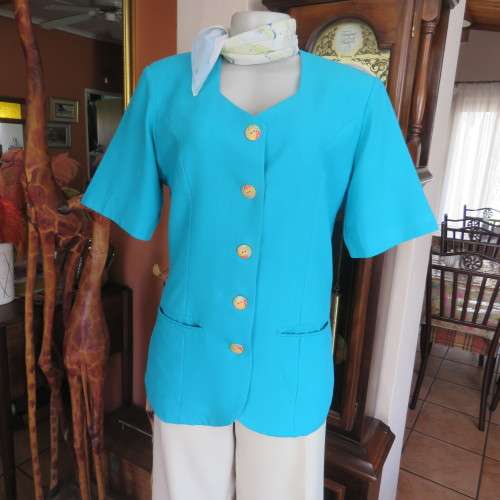 Elegant tailored turquoise fully lined short sleeve jacket. By KILDARE in size 36/12. As new.
