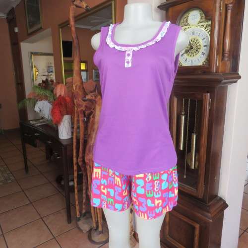 Short pants pyjamas size 34/10. Sleeveless purple slip over top. Top has been used-bottom new.