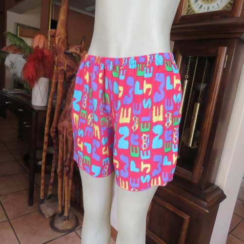 Short pants pyjamas size 34/10. Sleeveless purple slip over top. Top has been used-bottom new.