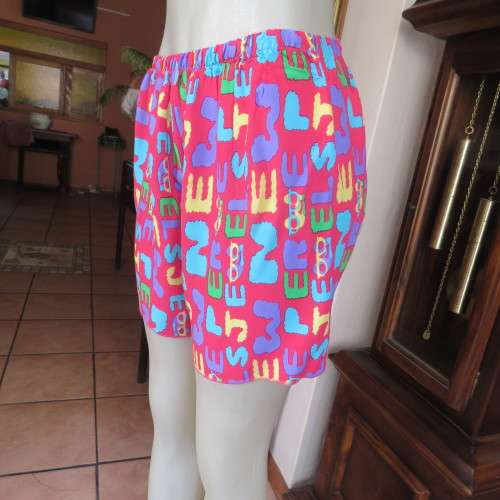 Short pants pyjamas size 34/10. Sleeveless purple slip over top. Top has been used-bottom new.