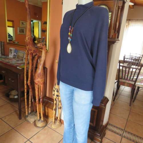 Soft and warm navy long sleeve acrylic knit sweather size 42/18. With raglan sleeves. As new.
