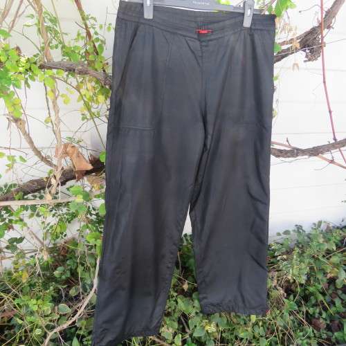 Men`s black CAVENLINE SPORTS pants. In 100% polyester fabric. Fully lined size Large. As new.