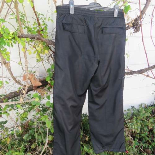 Men`s black CAVENLINE SPORTS pants. In 100% polyester fabric. Fully lined size Large. As new.