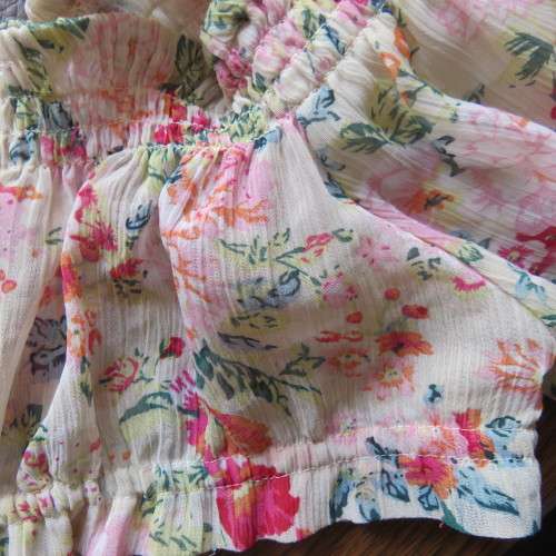Floral sheer crinkled polyester top with wide round neckline and bell sleeves. Size 30/6 by NEW WAVE