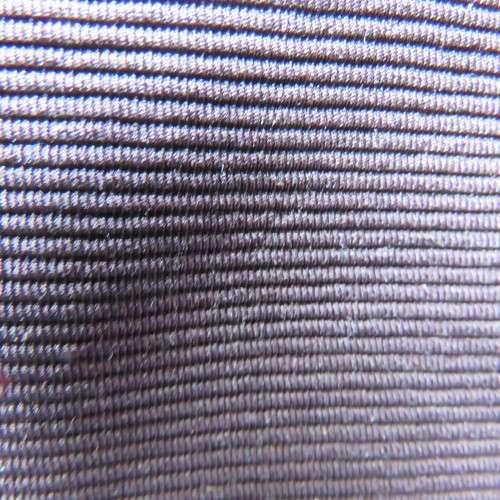 Little black ribbed polyester skirt. For girl 12 to 13 years old. Buckle on front. As new.