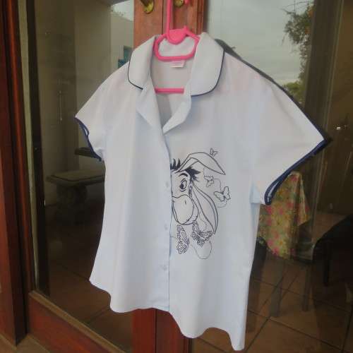 Baby blue DISNEY pyjama capped sleeve top by Shelley size 36/12. With donkey face. As new.