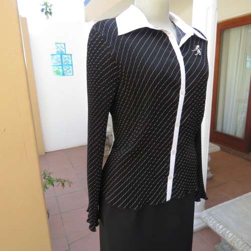 Elegant permanent pleated black top with thin diagonal stripes. Long sleeves. Size 38/14. As new.