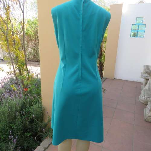 Vintage dress in empire style size 40/16 by MYRU MODELS. Jade colour with silver embroidery.