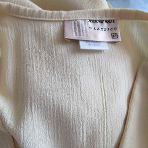 Fabulous corn colour dress with double breast fold over top. Pleated bottom. Size 36/12.Good cond.