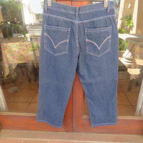 Men`s blue denim jeans in size 36/92cm by NETWORK. Pockets galore. Polycotton fabric. 69cm inner leg