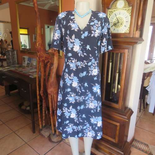 Princess style button down dress in navy with light blue posies. Size 44/20 by WOOLWORTHS from 80's