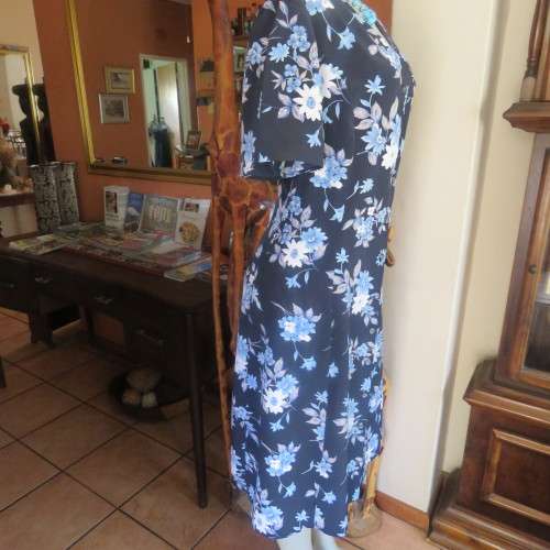 Princess style button down dress in navy with light blue posies. Size 44/20 by WOOLWORTHS from 80's