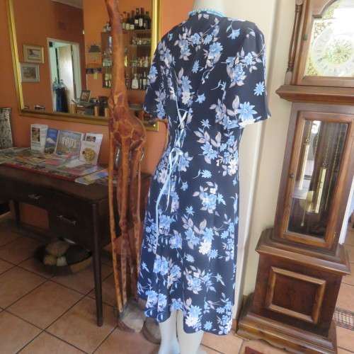 Princess style button down dress in navy with light blue posies. Size 44/20 by WOOLWORTHS from 80's