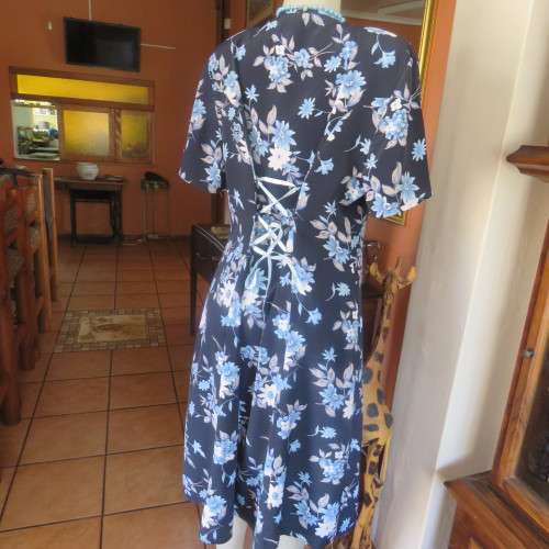 Princess style button down dress in navy with light blue posies. Size 44/20 by WOOLWORTHS from 80's