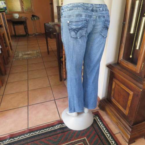 Ultra sexy low rise LEGIT blue denim jeans in size 32/8. Pockets back and front.Skinny straight leg
