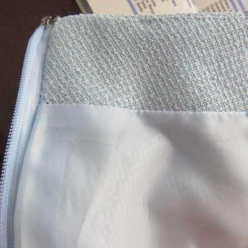 Stunning fully lined baby blue mini skirt with white seam in size 30/6. Pencil style. New condition