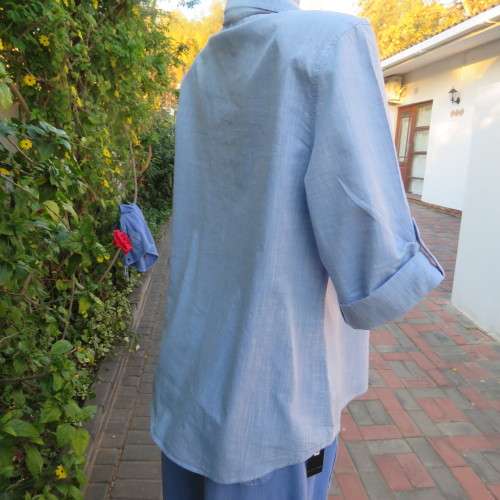 High quality light blue short sleeve shirt by David Jones. Size 42/18. 100% cotton. Never used.