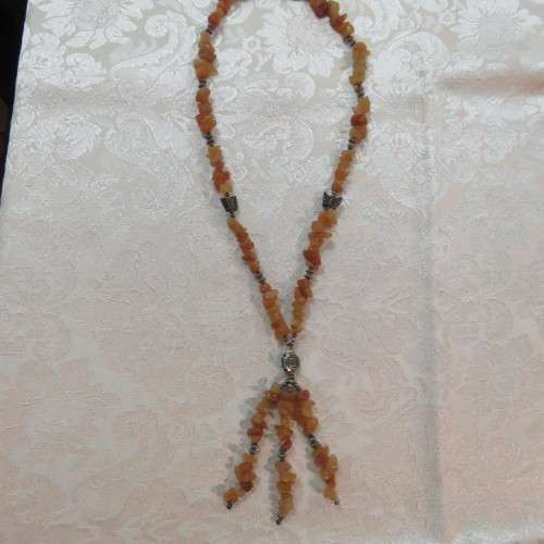 Beautiful genuine stone necklace made up of small brick colour stones. New.