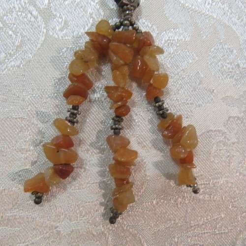 Beautiful genuine stone necklace made up of small brick colour stones. New.