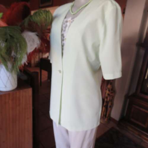 Light mint green short sleeve jacket/cover-up low V-front. Size 34/10 by SOFT BLOUSE. New condition.