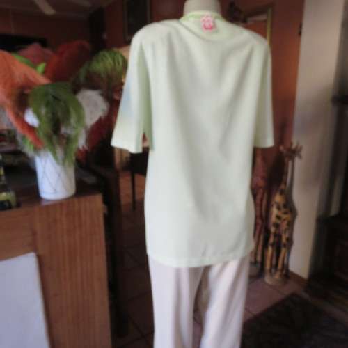 Light mint green short sleeve jacket/cover-up low V-front. Size 34/10 by SOFT BLOUSE. New condition.