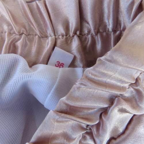 Glamour calf length nude colour skirt. Fully lined elasticated waist. Size 36/12. New condition.