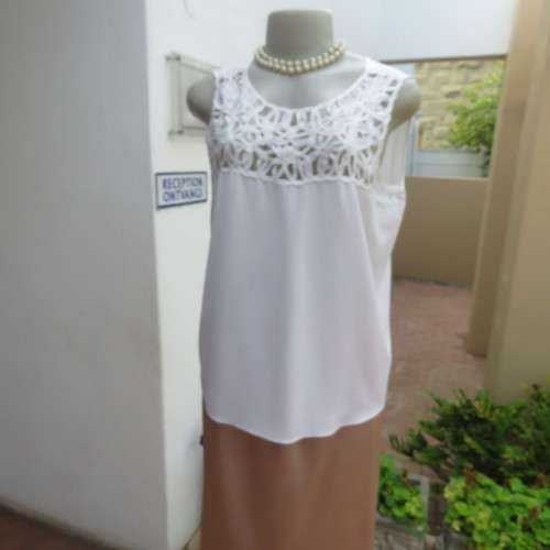 Stunning DELTON white sleeveless top. Amazing see-through ribbon decoration. Size 36/12. As new.