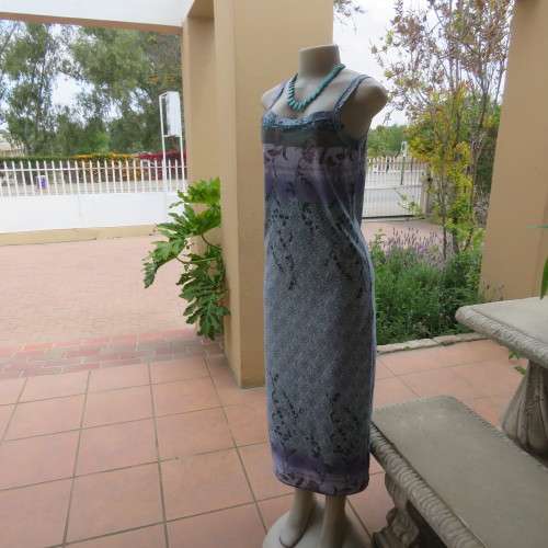 Beautiful summer shift dress with shoulder straps. Border across bust and seam. Size 34/10. As new.